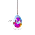 Close-up detail of multi-colored K9 crystal suncatcher prism with 6cm x 4.5cm size - Dragon Eye (Approx 60x45mm)