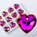 Close-up of faceted heart-shaped crystal pendants for DIY jewelry making. - Heart Style B / 12 Pieces/Pack / Purple