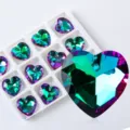 Macro view of iridescent heart-shaped faceted crystal pendants for DIY jewelry making - Heart Style B / 12 Pieces/Pack / Green