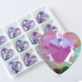 Detailed macro view of heart-shaped crystal pendant with iridescent purple facets - Heart Style B / 12 Pieces/Pack / Light Purple