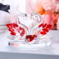 Detailed macro view of crystal swan couple ornament featuring red heart and faceted ruby wings - Heart-to-Heart Swan / Red