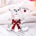 Close-up of a crystal bear figurine holding a heart engraved with I LOVE YOU message - Red Bowtie Bear Love with Base