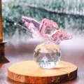 Exquisite pink faceted crystal butterfly perched on a sparkling crystal ball base. - Butterfly Design / Pink