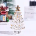 Detailed shot of a crystal Christmas tree ornament with elegant gold-tipped branches. - Transparent Crystal Christmas Tree