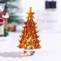 Detailed amber crystal Christmas tree ornament with intricate glass textures and base - Amber Crystal Christmas Tree