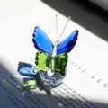 Elegant blue and green faceted crystal butterfly ornament with light-refracting base - Butterfly Design / Blue and Green