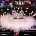 Elegant crystal swan car ornament with white feathers and pearls for car interior decor. - Swan With Pearl Feather Pad / Red Eye Pink