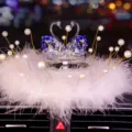 Elegant blue crystal swan car ornament decorated with white feathers and pearls for car interior - Swan With Pearl Feather Pad / Red Eye Blue