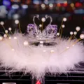 Elegant purple crystal swan car interior ornament decorated with white feathers and pearls - Swan With Pearl Feather Pad / Red Eye Purple