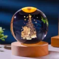 Detailed view of glowing Christmas crystal ball with Santa Claus and wooden base - Santa Claus / 6cm Sphere (No Light Base)