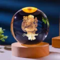 Detailed close-up of 3D Santa Claus laser engraving inside a warm glowing crystal ball - Santa Gift / 6cm Sphere (No Light Base)
