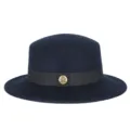 Stylish navy blue wool felt boater hat featuring a black ribbon and gold metal emblem. - Fits 56-58cm Head / Navy Blue