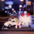 Crystal rhinestone classic car perfume holder set with cute couple figures and feather decor. - White Car + Doll + Feather Balloon + Anti-Slip Mat