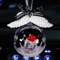 Elegant crystal ball car pendant with white angel wings and red flower ornament inside. - Gift Ball with Black Ribbon and White Wings / Red