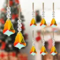 Close-up view of 8 iridescent faceted crystal bell ornaments for Christmas decor - Style 38 Navy Bird Print / Xmas Tree Single