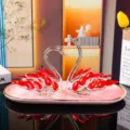 Elegant red and clear crystal swan couple figurines on a pink ceramic tray for home decor - Swan Crystal Ornament Style 2 With Pink Tray / Red