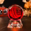 Close-up of a 3D laser engraved crystal ball night light with warm red lighting - Mars (JYSJ-SJQ-019) / Color 60 Ball With Rechargeable Color Light Crystal Base
