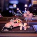 Cute rhinestone vintage car car ornament with couple dolls and pink balloon tree decor for interior. - Pink Car Ornament with Doll, Rhinestone Balloon, and Anti-Slip Mat