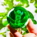 Detailed macro view of a 3D laser engraved astronaut inside a green crystal ball - Astronaut (JYSJ-SJQ-019) / 60 Single Sphere