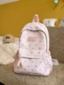 Lightweight pink commuter backpack with silver heart pattern and LXINDA logo label. - Pink