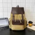 Mochila de lona caqui vintage con detalles de cuero marrón y cierre de cordón ajustable - Caqui