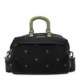 Stylish black canvas travel duffel bag with green handles and embroidered bow patterns - Black