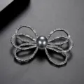 Elegant silver-tone bow brooch with grey shell pearl and cubic zirconia accents - Bowknot Grey Pearl Style (X19032703-Rh) / Silver