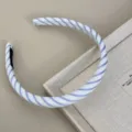 Detailed close-up showing the blue and white striped fabric texture of this elegant headband - Blue White Headband - Thick Stripe