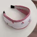 Close-up of sweet white headband with red cherry patterns and gingham trim. - Wide Headband Style (FQ86173) / 4cm