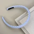 Detailed view of a light blue and white striped fabric headband with texture details - Blue White Headband - Double Stripe