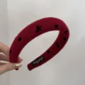 Detail view of a red felt wide headband featuring black bow and polka dot patterns - Bow / 3cm / Red