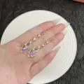 Elegante paarse kristallen blad kwastje oorlijnen met vergulde afwerking sieraden. - Oorlijn stijl / Goud Paarse Oorlijn