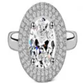 Anillo plateado con circonita ovalada central y un doble halo de piedras brillantes - Talla 5 / Blanco Claro