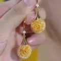 Detailed view of luxury gold-tone mesh earrings featuring a sparkling rose design motif - Mesh Ball Rose Drop (E4851金)