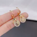 Gold money bag earrings with cat's eye stone and dollar sign charm - White Ear Buckle Style (E2034) / Gold