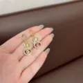 Elegant Chinese style gold fortune bag hoop earrings with red cat eye stone and crystal inlay - Red Ear Buckle Style (E2034) / Gold
