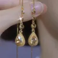 Elegant Maillard coffee crystal teardrop tassel earrings with vintage gold finish - Long Water Drop Tassel Style (E4255) / Champagne