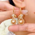 Elegant gold lucky bag dangle earrings featuring champagne cat-eye stone and rhinestones - Champagne Bead Style (E4971) / Gold Champagne Bead