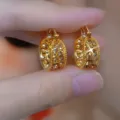 Elegant vintage gold hoop earrings featuring sparkling Maillard brown crystals for a luxury look. - Hollow Pattern Wide Hoop Style (E4452) / Light Burgundy Champagne