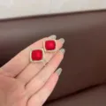 Close-up of vintage square red earrings with sparkling rhinestones in gold setting - Geometric Square / Matte Red Style (E2008)