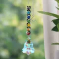 Detailed macro view of rainbow maker suncatcher with seven chakra crystals and prism pendant - 米字葫芦