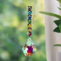Detailed view of a handmade rainbow prism suncatcher with seven chakra-colored crystals - 切面葫芦