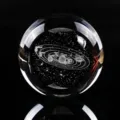 Close-up detail of laser-engraved solar system inside a clear crystal ball - Single Ball (Solar System) / 40mm Ball With Warm Light Base