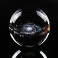 Close-up of clear crystal ball with internal 3D laser-etched galaxy design - Single Ball (Galaxy) / 40mm Ball With Warm Light Base