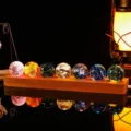 Seven colorful luminous glass balls on a long wooden base for home decor - Beech Wood / Rectangular Base