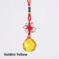 Golden yellow faceted crystal ball pendant featuring a decorative red braided cord - Gold Yellow