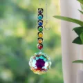 Close-up of a rainbow maker suncatcher with heart-shaped stones and prism crystal ball. - Sunflower