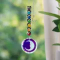 Detailed macro shot of suncatcher crystal prisms and hanging rainbow hearts - Moon