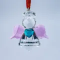 Close-up of faceted crystal angel ornament with pink wings and blue heart centerpiece. - Angel with Heart / Pink Wings