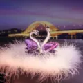 Elegant purple crystal swan car ornament with heart-shaped design on feather base - Purple Swan with Feather and Anti-slip Mat / Purple